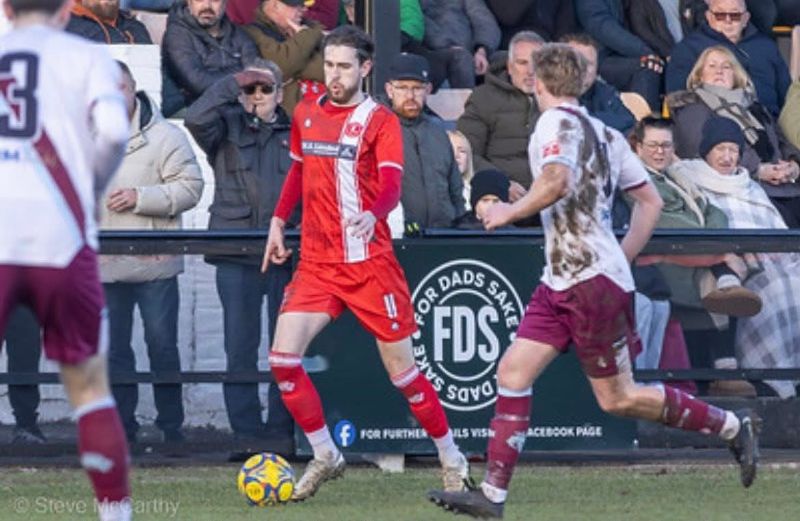 A football match in front of a pitchside For Dads Sake board (photo: Steve McCarthy)